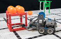 VEX IQ robot built by students playing a challenge